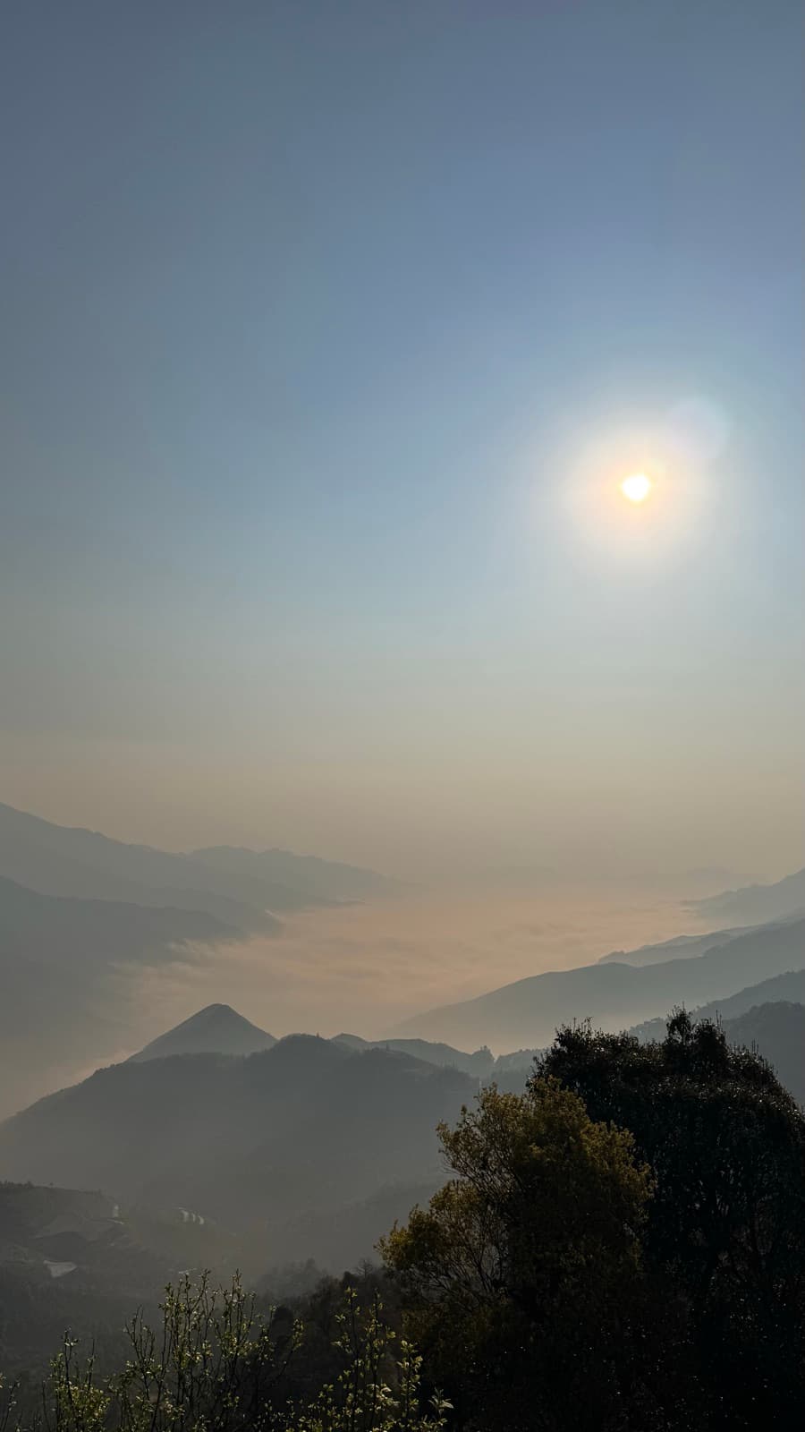 Sunrise over a misty valley from the ridge of Tà Xùa