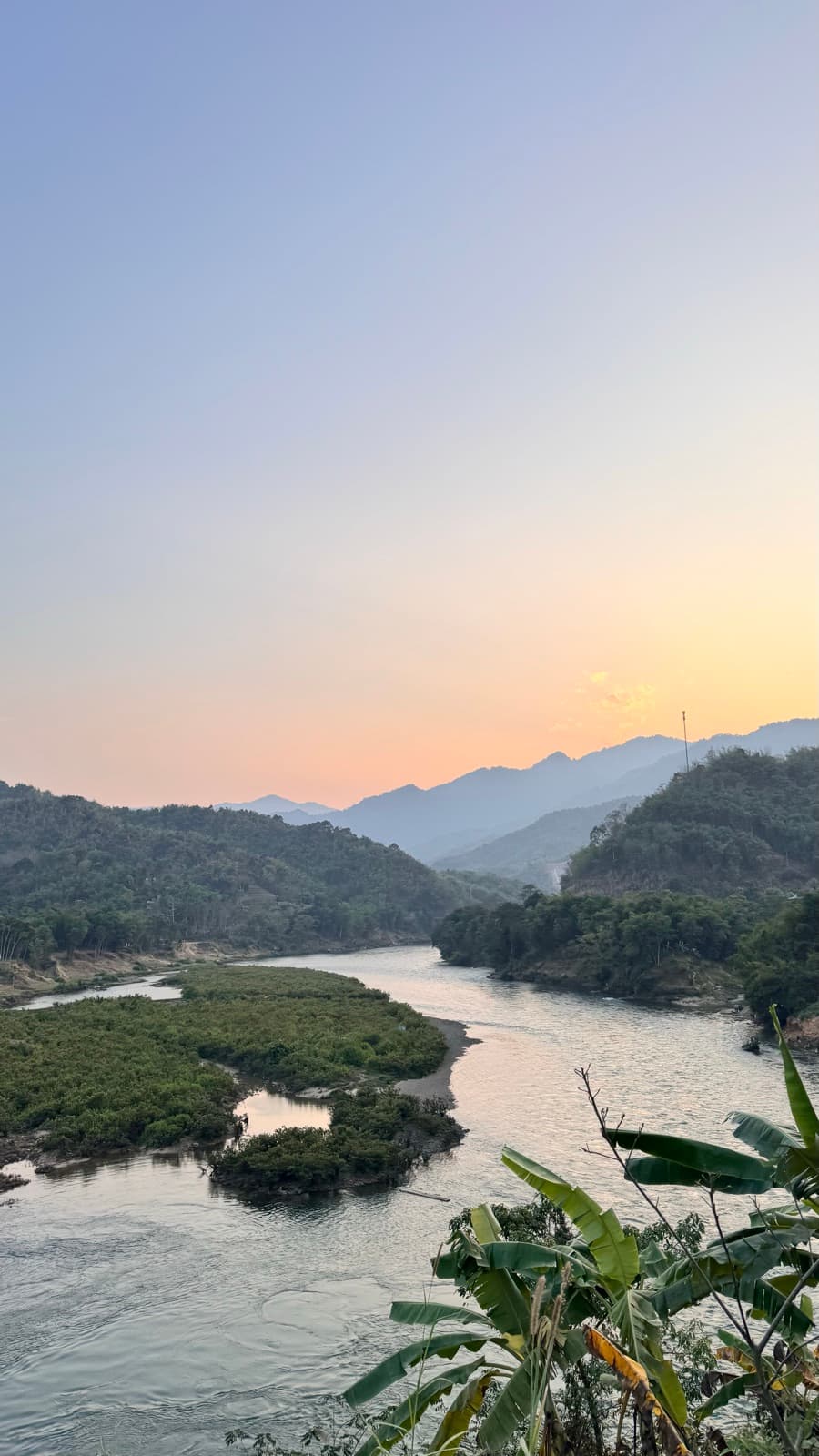 A river winding through the hills at sunset near Mai Châu